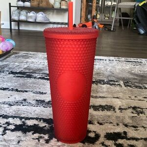 Red studded Starbucks cup